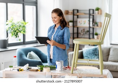 Furniture Restoration, Diy And Home Improvement Concept - Happy Woman With Tablet Pc Computer Preparing Old Wooden Chair For Renovation