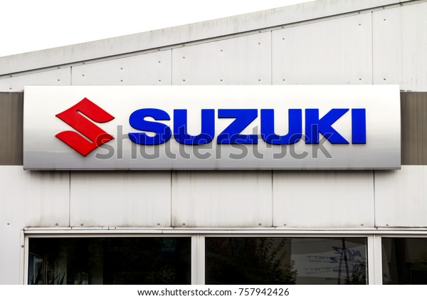 Furth,\
GERMANY-October 8: SUZUKI logo, dealer in Furth, Germany. Suzuki\
Motor Corporation is a Japanese multinational corporation\
headquartered in Minami-ku, Hamamatsu,\
Japan.