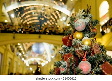 Fur-tree Densely Covered By Christmas Ornaments In Shopping Centre