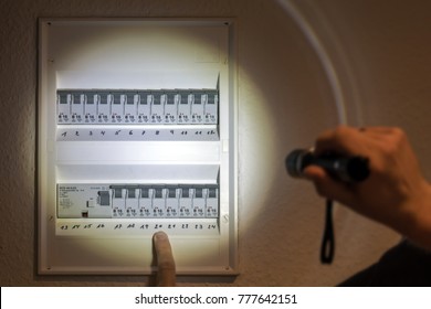 Fuse Box Illuminated With A Flashlight In Case Of Power Failure