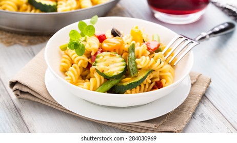 Fusilli With Mixed Grilled Vegetables In A Small Bowl.