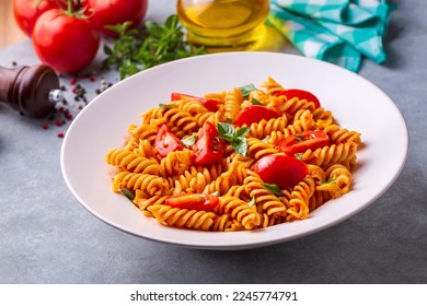 Fusilli pasta, spiral or spirali pasta with tomato sauce - Italian food style (Turkish name; domatesli, domates soslu burgu makarna)