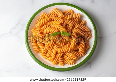 Fusilli pasta, spiral or spirali pasta with tomato sauce - Italian food style