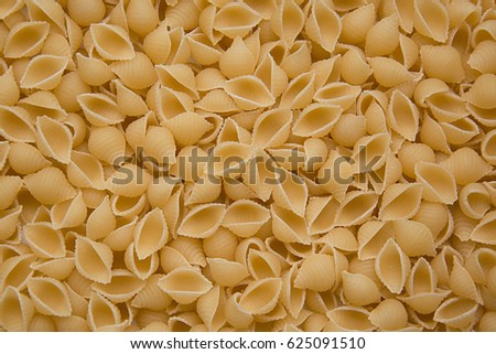 Fusilli Pasta texture background. Pasta is a staple food of traditional Italian cuisine.