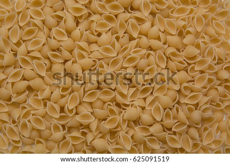 Fusilli Pasta texture background. Pasta is a staple food of traditional Italian cuisine.