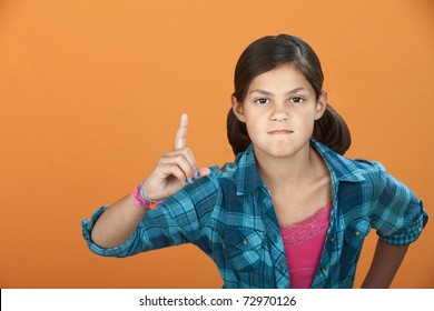 Fussy Latina Child Pointing Index Finger Upward