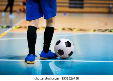 Futsal Junior Player On Indoor Training. Soccer Winter Class At School Indoor Futsal Court. Young Player In An Indoor Play-field