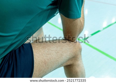 a futsal player sitting on the bench