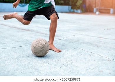 Futsal players barefoot. Futsal player control and shoot ball to goal. Soccer sports outdoor. Football futsal player, Old ball. - Powered by Shutterstock