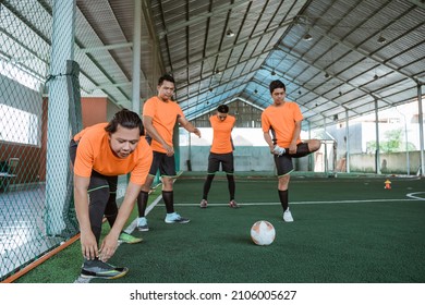 Futsal Players Stretch With The Team Before The Futsal Match