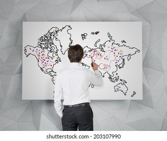 Future Business Developments Strategy. Businessman Drawing The World Map And The Main Points To Expand The Business.