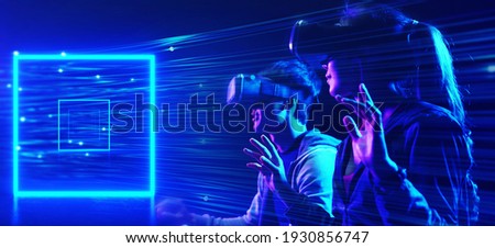 Future digital technology metaverse game and entertainment, Teenager having fun play VR virtual reality goggle, sport game 3D cyber space futuristic neon colorful background, 