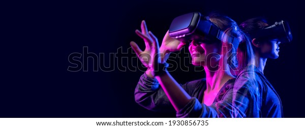Future\
digital technology metaverse game and entertainment, Teenager\
having fun play VR virtual reality goggle, sport game 3D cyber\
space futuristic neon colorful background,\
