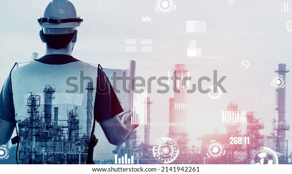 Future factory plant and inventive energy\
industry concept in creative graphic design. Oil, gas and\
petrochemical refinery factory with hologram showing next\
generation of power and energy\
business.