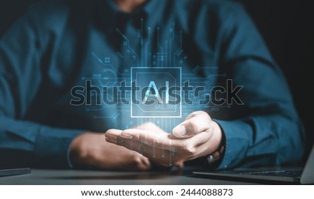 future, intelligence, learning, neural, science, network, system, chipset, artificial, logic. A man is holding a chipset with a blue square on it that AI. Concept of artificial intelligence.