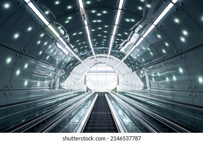 Future is now: escalator moving staircase inside modern subway station