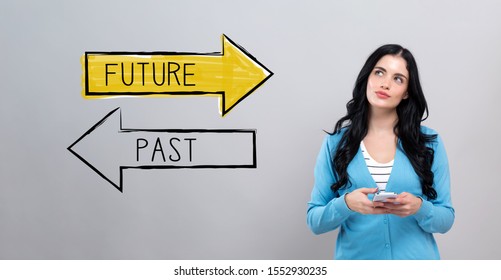 Future past and thoughtful young woman holding smartphone