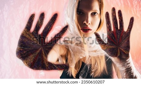 Future prediction. Nft art. Palmistry fortune. Confident oracle woman face colorful glitch noise hand palms on peach pink glow background.