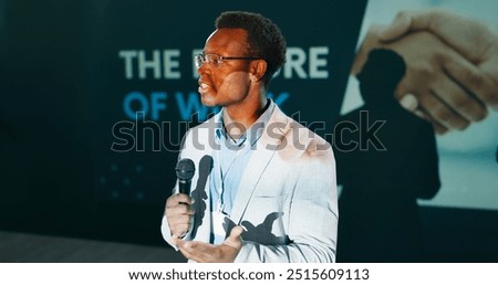 Future, presentation and speech of man with microphone on stage for business or work seminar. Coaching, development and training with African speaker at event for conference or public speaking
