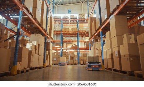 Future Technology 3D Concept: Automated Modern Retail Warehouse AGV Robots Transporting Cardboard Boxes In Distribution Logistics Center. Automated Guided Vehicles Delivering Goods, Products, Packages