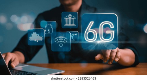 Future technology 6G network wireless systems and IoT. Businessman hand touching Virtual Reality screen. Wifi and Smart city communication networks on smartphones, Global wireless devices.