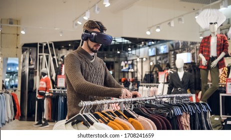 Future Technology And Business Concept: The Man With Virtual Reality Glasses In A Retail Store