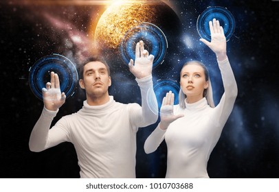 Future Technology And People Concept - Couple Of Scientists Or Astronauts With Planet Hologram Over Tablet Pc Computer At Space Laboratory