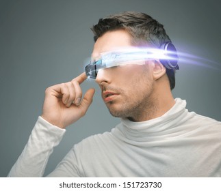 Future Technology And Science Fiction Concept - Man With Digital Glasses