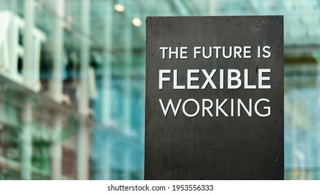 The future of work is Flexible sign in front of a modern office building - Shutterstock ID 1953556333