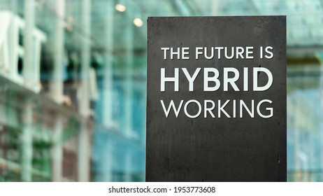 The Future Of Work Is Hybrid Sign In Front Of A Modern Office Building