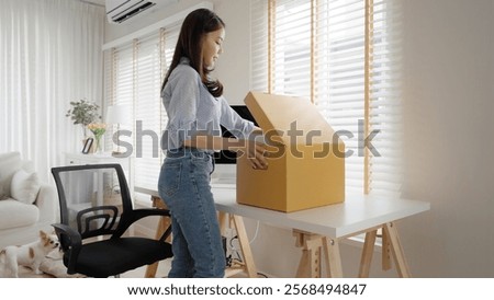 Future of workforce remote work fully permanent. Asia people happy relax move job to new small workspace set up desk picking file folder from box. Keep it chores neat start long term plan career work.