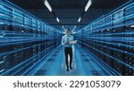 Futuristic 3D Concept: Big Data Center Chief Technology Officer Using Laptop Standing In Warehouse, Information Digitalization Lines Streaming Through Servers. SAAS, Cloud Computing, Online Service