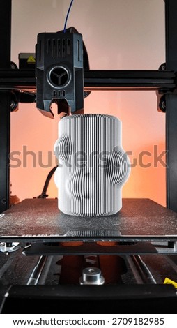 A futuristic 3D printer sculpts a wavy vase, embodying modern craftsmanship and Miro inspired digital creativity during Innovation Day