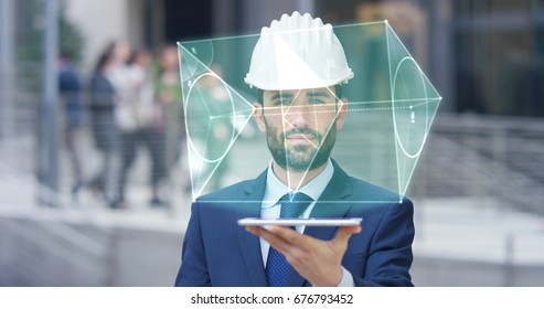 A Futuristic Architect, Engineer, Builder, In A Suit, In A White Helmet, Holds A Tablet With A Holographic Hologram Geometric Project Of Triangles. Concept: Future, Construction, Technology, Business.