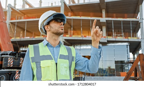 Futuristic Architectural Engineer Wearing Augmented Reality Headset and Using Gestures to Control Commercial Building Construction Site. In Background Skyscraper Formwork Frames and Industrial Crane - Powered by Shutterstock