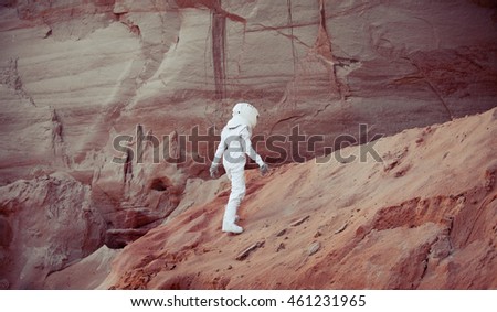 futuristic astronaut on another planet, image with the effect of toning