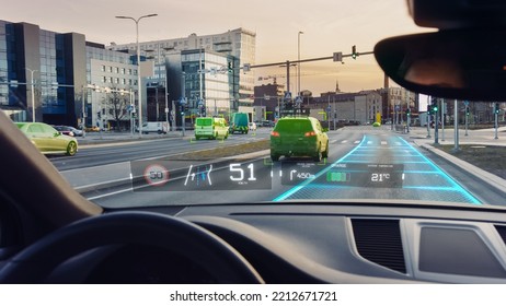 Futuristic Autonomous Self-Driving Car Moving Through City, Head-up Display Showing Infographics: Speed, Distance, Navigation. Road Scanning. Driver Seat POV, First Person View FPV.