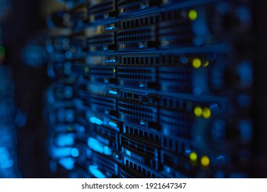 Futuristic background image of rack server with blinking lights in supercomputer, copy space - Shutterstock ID 1921647347