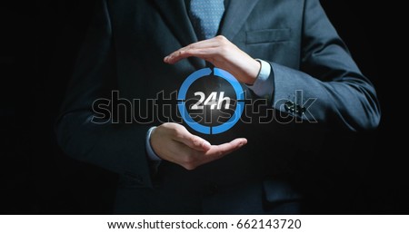 Futuristic businessman, assistant, worker in suit holds a blue ball with the inscription 24 hours on a black background. Concept 24 hours work, fast delivery, help always, communication, sale purchase