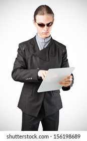 Futuristic Businessman Or Secret Agent Working On His Tablet.