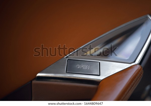 Futuristic car door open\
button