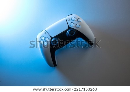
futuristic concept abstract gamepad in neon vibrant  blue light. place for text. copy space