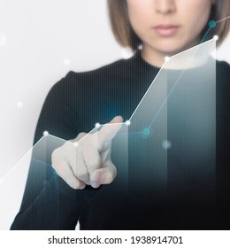 Futuristic digital bar graph presentation by a businesswoman in black shirt
