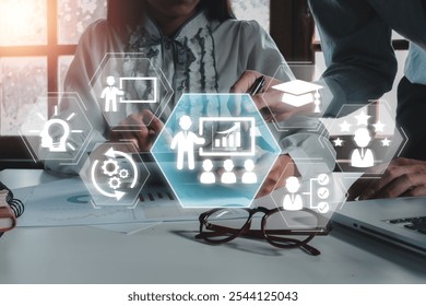 Futuristic digital interface showcasing training and development concepts with business icons and technology integration. - Powered by Shutterstock