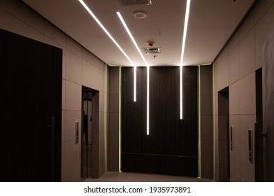 Futuristic Elevator Lobby With Modern Strip Lighting 