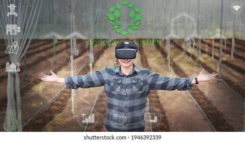 Futuristic farmer wearing visual reality glasses technology for controlling or development agricultural products . Agriculture technology concept. - Powered by Shutterstock