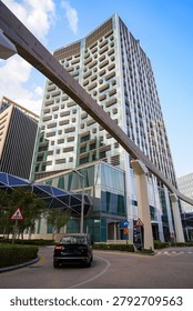 Futuristic geometric skyscraper, skybridge and elevated transit rail track at King Abdullah Financial District KAFD, Riyadh, Saudi Arabia
