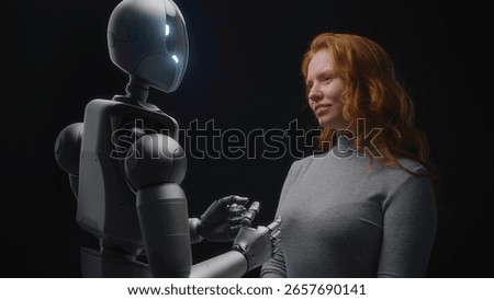 Futuristic Human-Machine Concept: Visualization of Young Woman Speaking with Advanced Humanoid Robot. People and Robots Working Together. Collaboration Between Humanity and Artificial Intelligence.