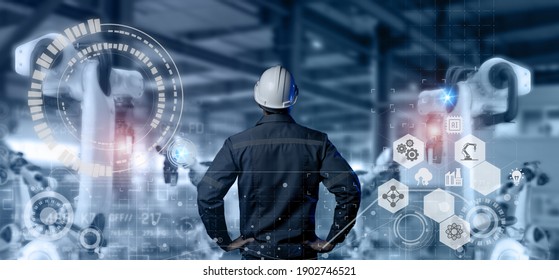 futuristic industry 4.0 technology concept, engineer stand in front of robot in manufacturing and use automaion robot with augmented mixed virtual reality, artificial intelligence, machine lernning 5g