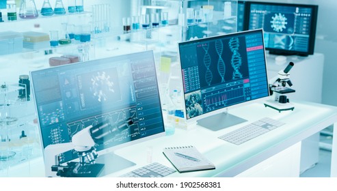 Futuristic laboratory equipment - coronavirus testing. Computer screens in laboratory. DNA models and coronavirus research - Shutterstock ID 1902568381